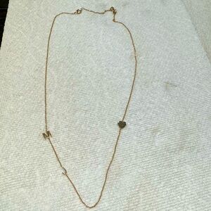 Maya Brenner rose gold necklace with M and J